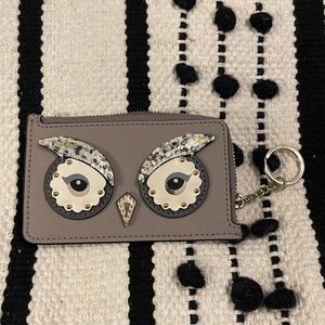 Small Kate Spade wallet with keychain.